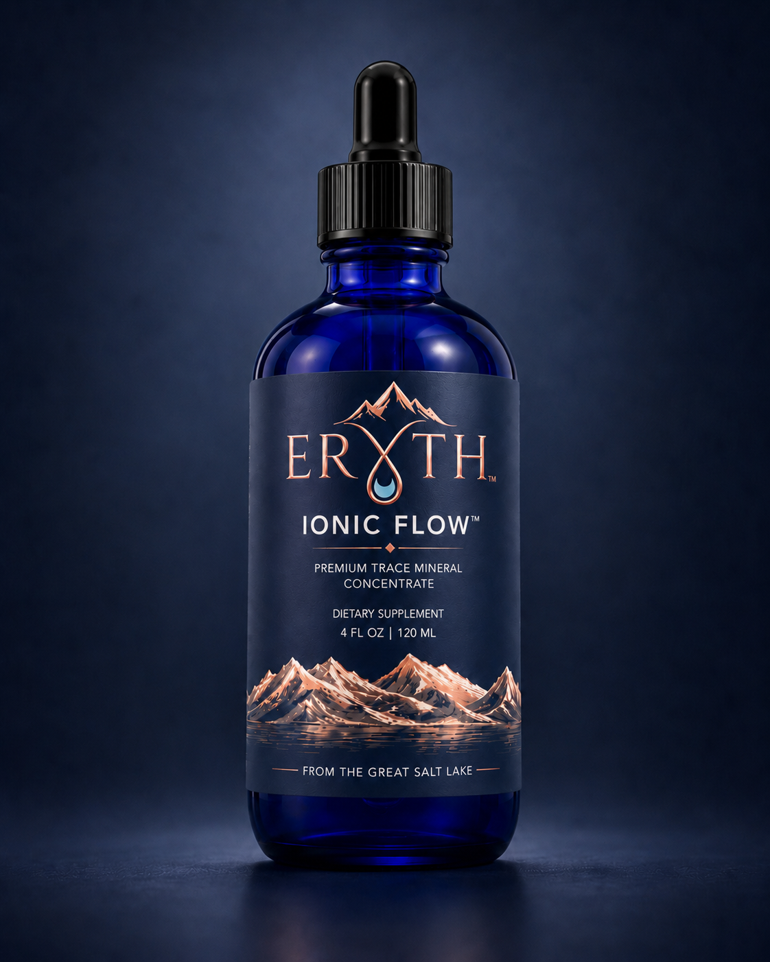 ERYTH Ionic Flow cobalt blue glass bottle of liquid trace minerals on a deep navy background.